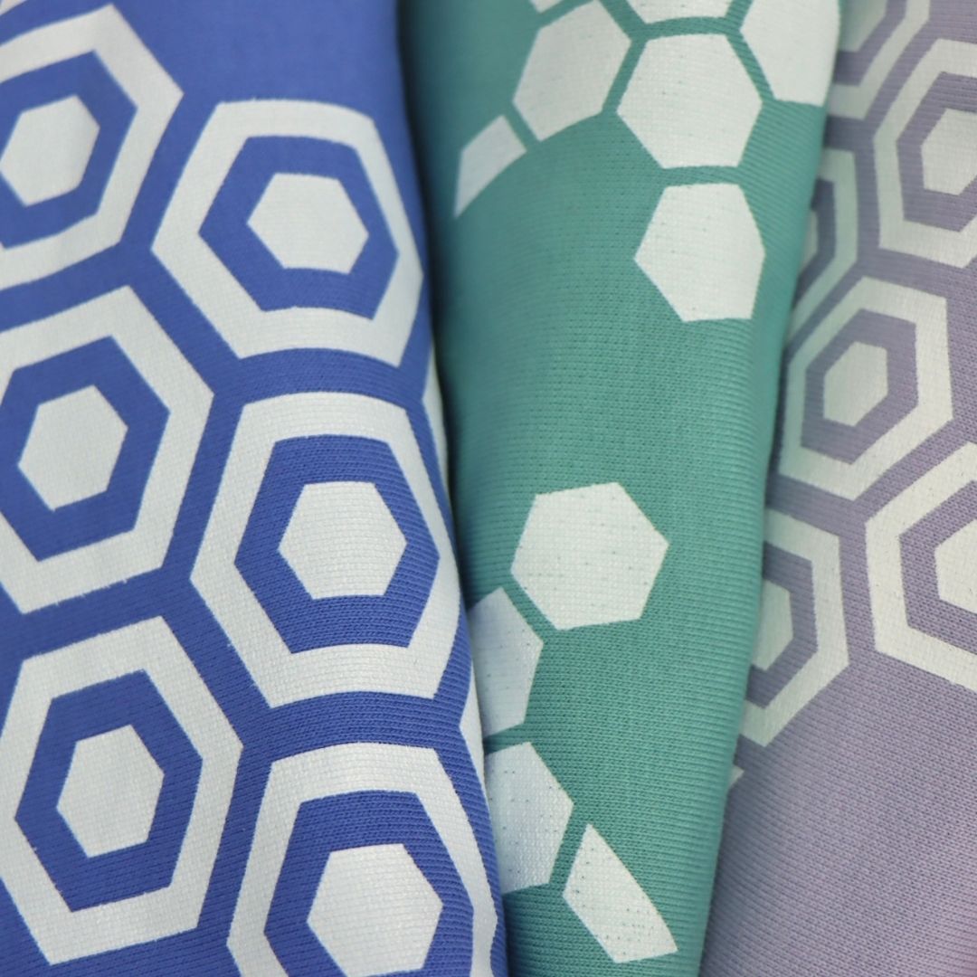 organic sweatshirts in lavender, teal and bright blue, showcasing striking turtle designs